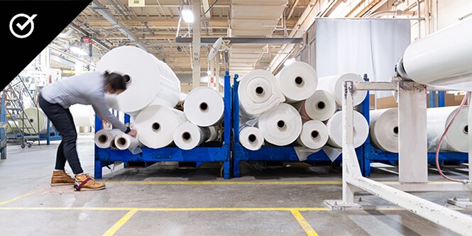 Large rolls of paper in a production warehouse
