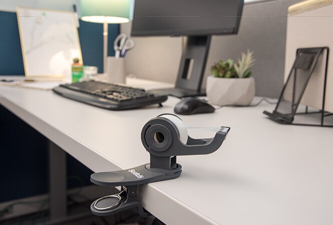 Scotch™ Clip & Twist Desktop Tape Dispenser in use
