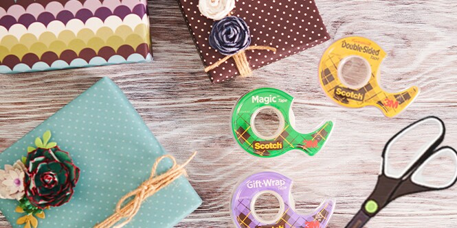 Nicely wrapped presents alongside Scotch® Clear Tapes and Scotch™ Titanium Scissors on a table
